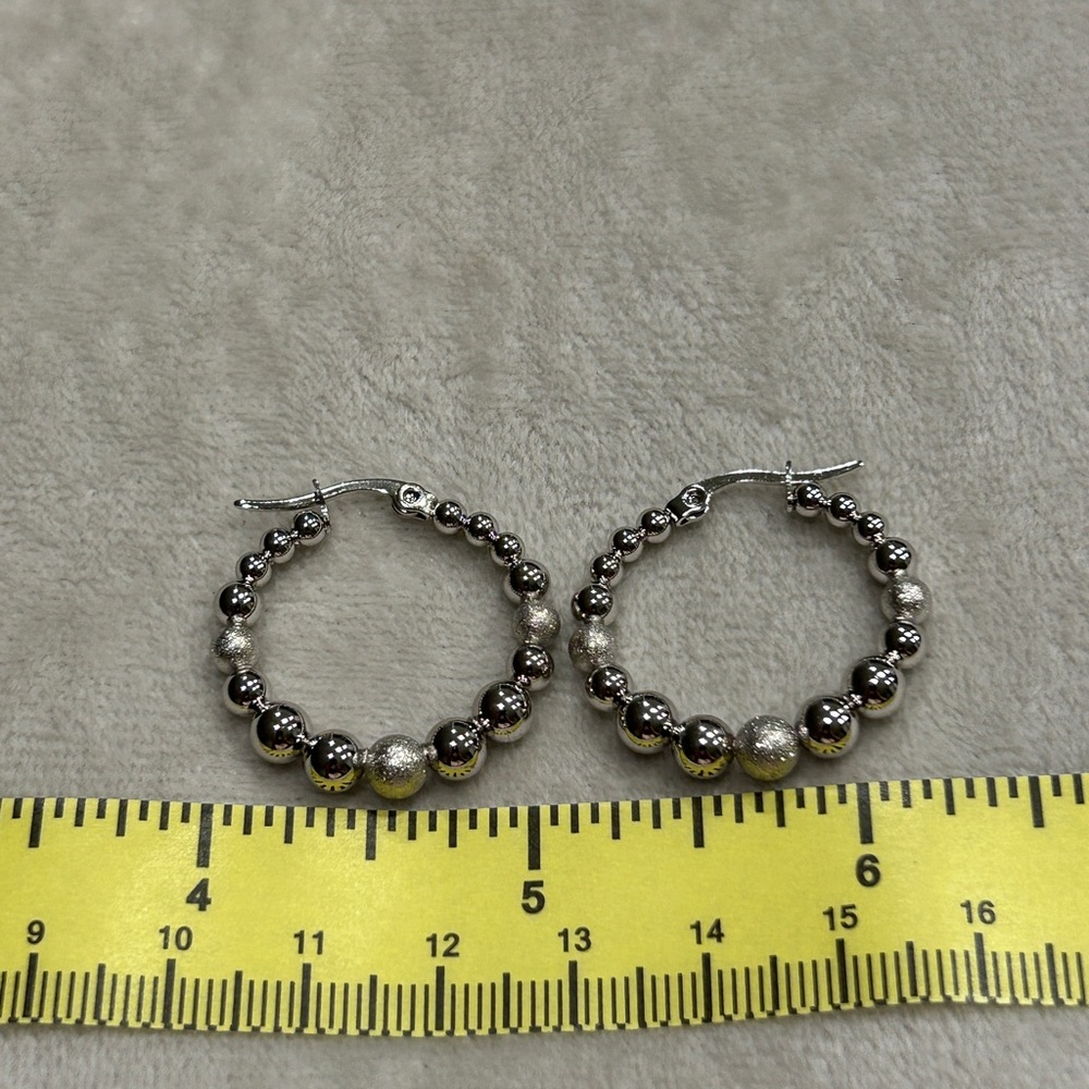 Rod Houma played Hoop Earrings